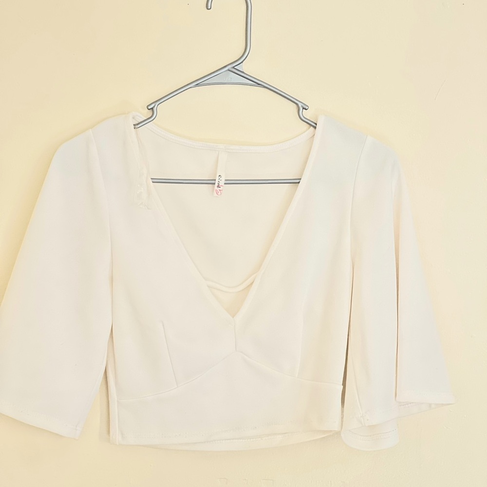 White top with flared arms